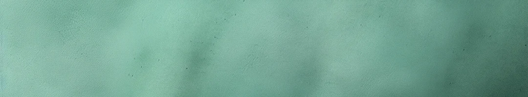 mint-green-background-with-subtle-grain-texture-elegant-design-top-view-marokee-velvet-fabric-ba